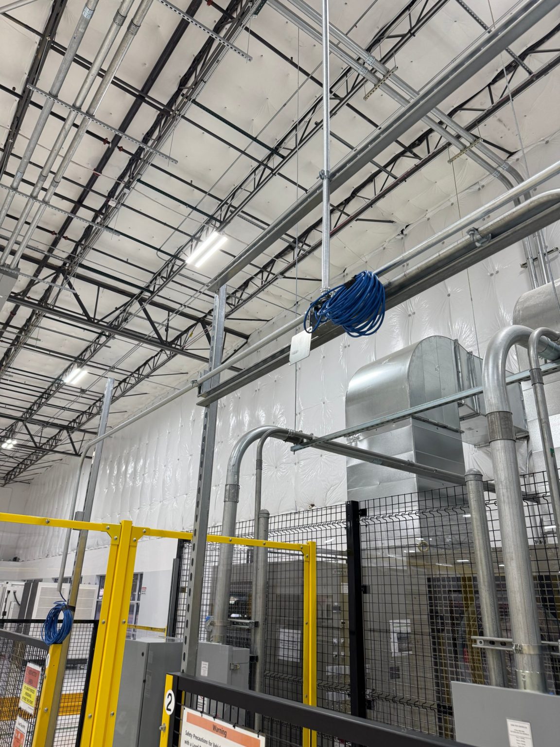 Conduit and cabling above EV charger test cells